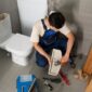 male plumber working fix problem 85x85